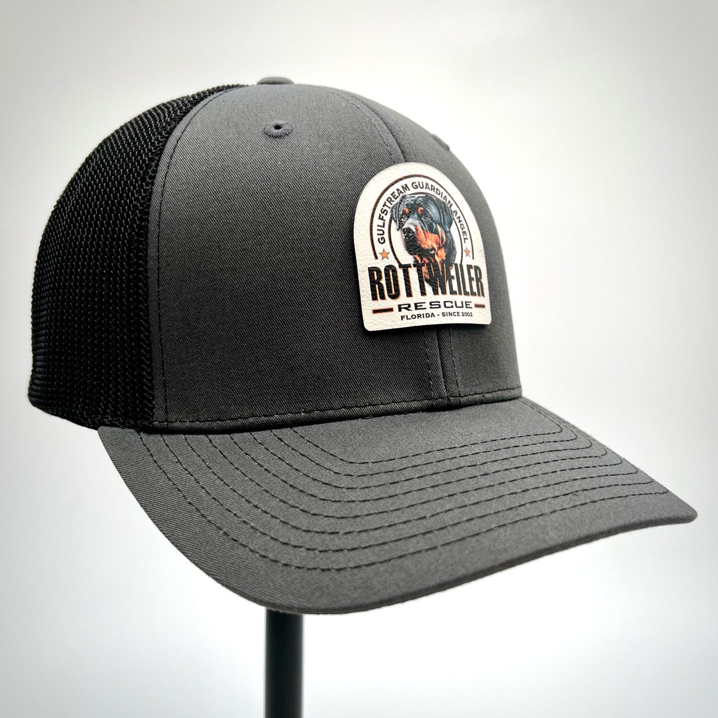 Gulfstream Guardian Angel Rottweiler Rescue charcoal and black dad hat with a full color patch.