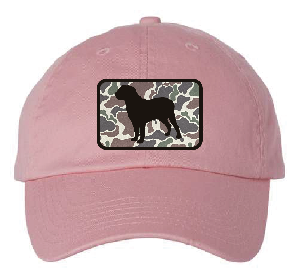 Pink dad hat featuring the Dogue de Bordeaux silhouette in a camo and black leatherette patch. Front view.