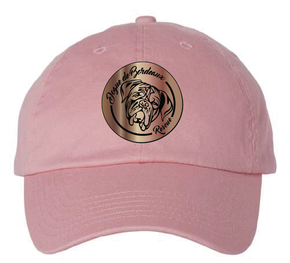 Pink dad hat featuring the Dogue de Bordeaux Rescue logo in a copper and black acrylic patch. Front view.