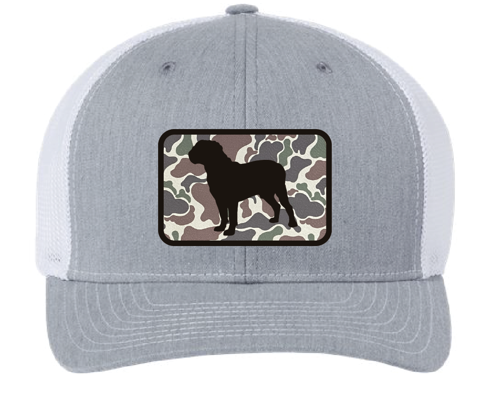 Heather gray/white trucker hat featuring the Dogue de Bordeaux silhouette in a two tone leatherette patch. Camouflage leatherette engraves to black. Front view.