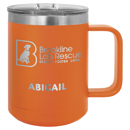 Orange laser engraved 15 of coffee cup featuring the Brookline Lab Rescue logo and the name "Abigail"