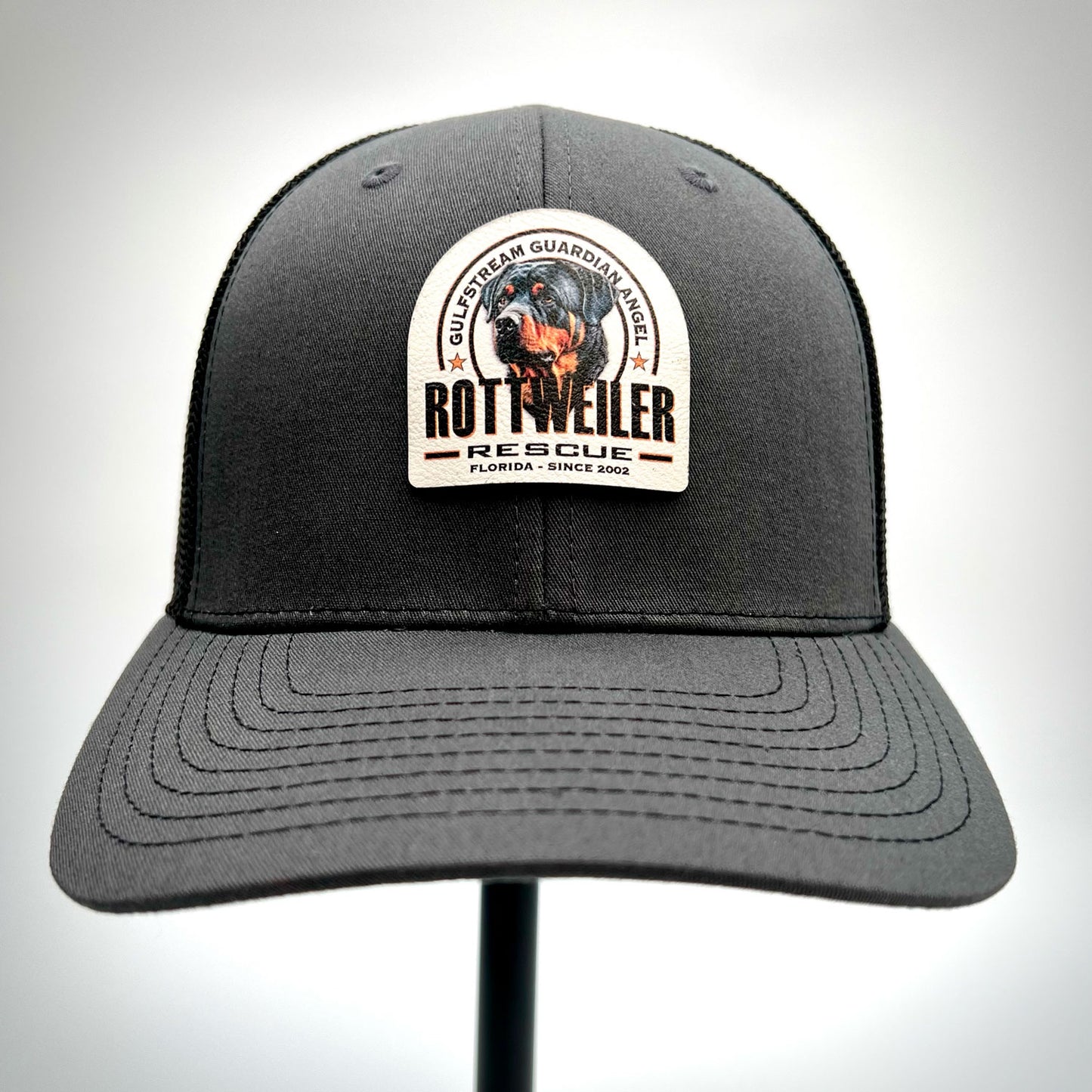 Gulfstream Guardian Angel Rottweiler Rescue charcoal and black dad hat with a full color patch.
