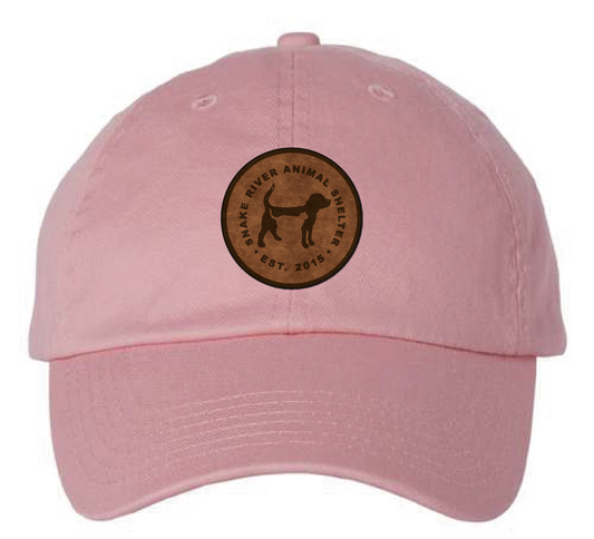 Pink Snake River Animal Shelter patch hat with brown and black patch.