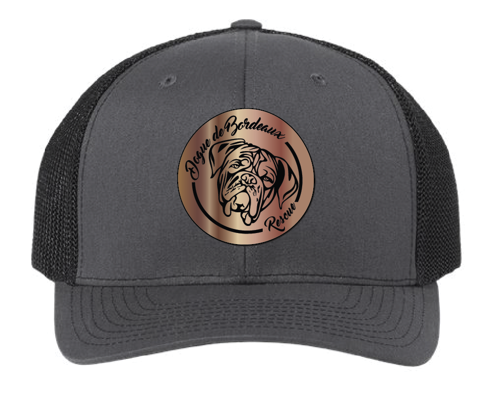 Charcoal/Black trucker hat featuring the Dogue de Bordeaux Rescue, Inc. logo in a two tone (copper and black) acrylic patch. Front view.