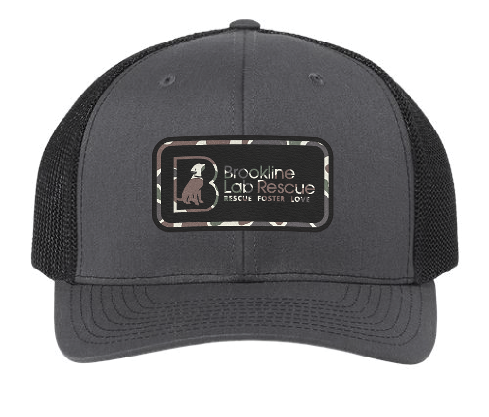 Black/Charcoal trucker hat featuring the Brookline Lab Rescue logo. Patch is camouflage leatherette and engraves to black.